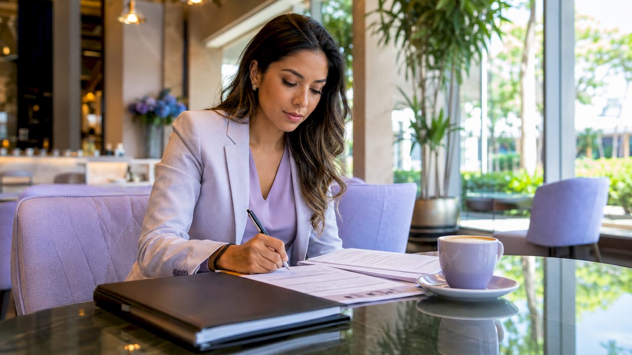 Agent reviewing local lead lists at desk