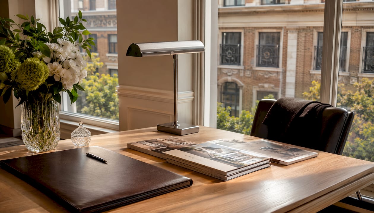 Luxurious listing presentation materials on desk in office