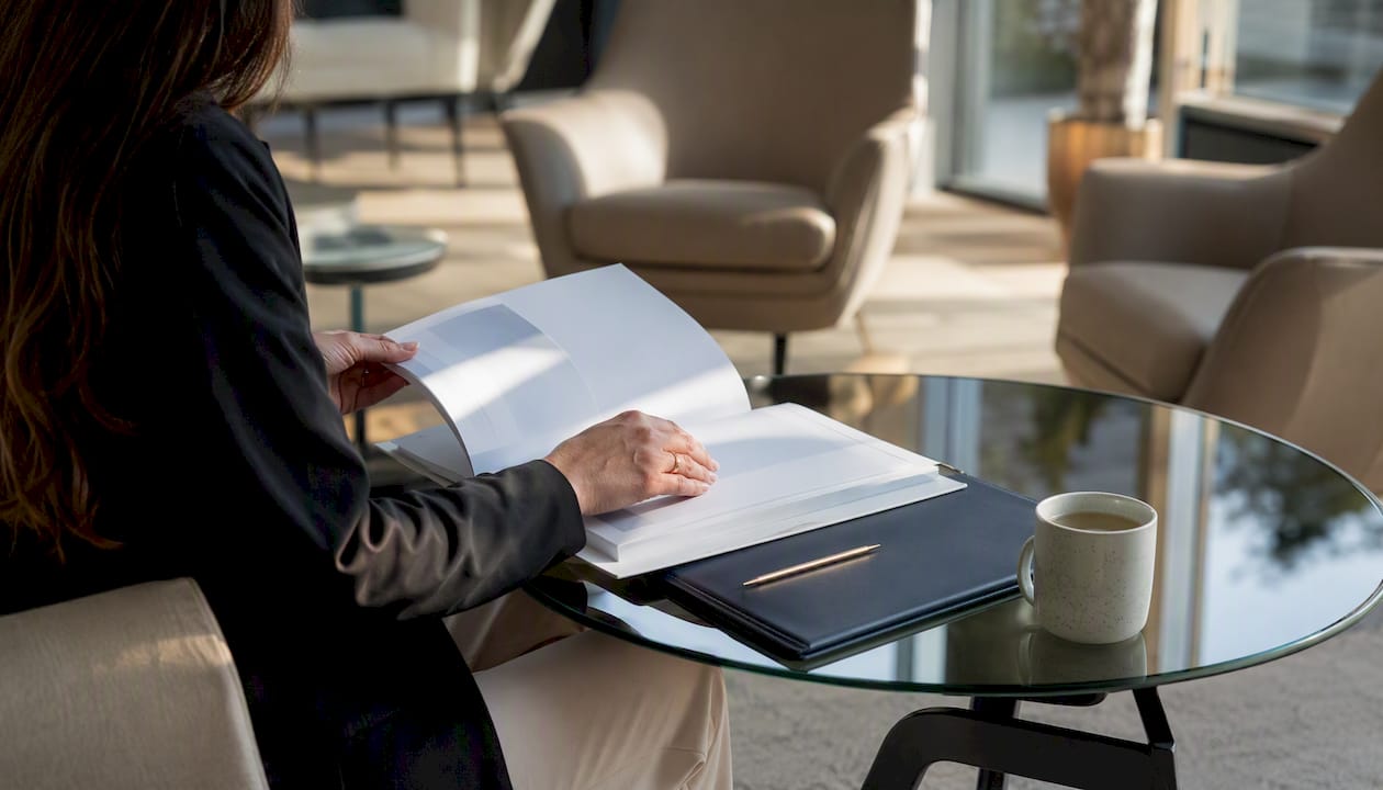 Hands holding marketing report in conference room