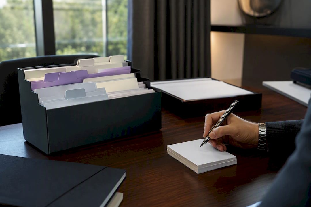 Hand organizing drip campaign index cards