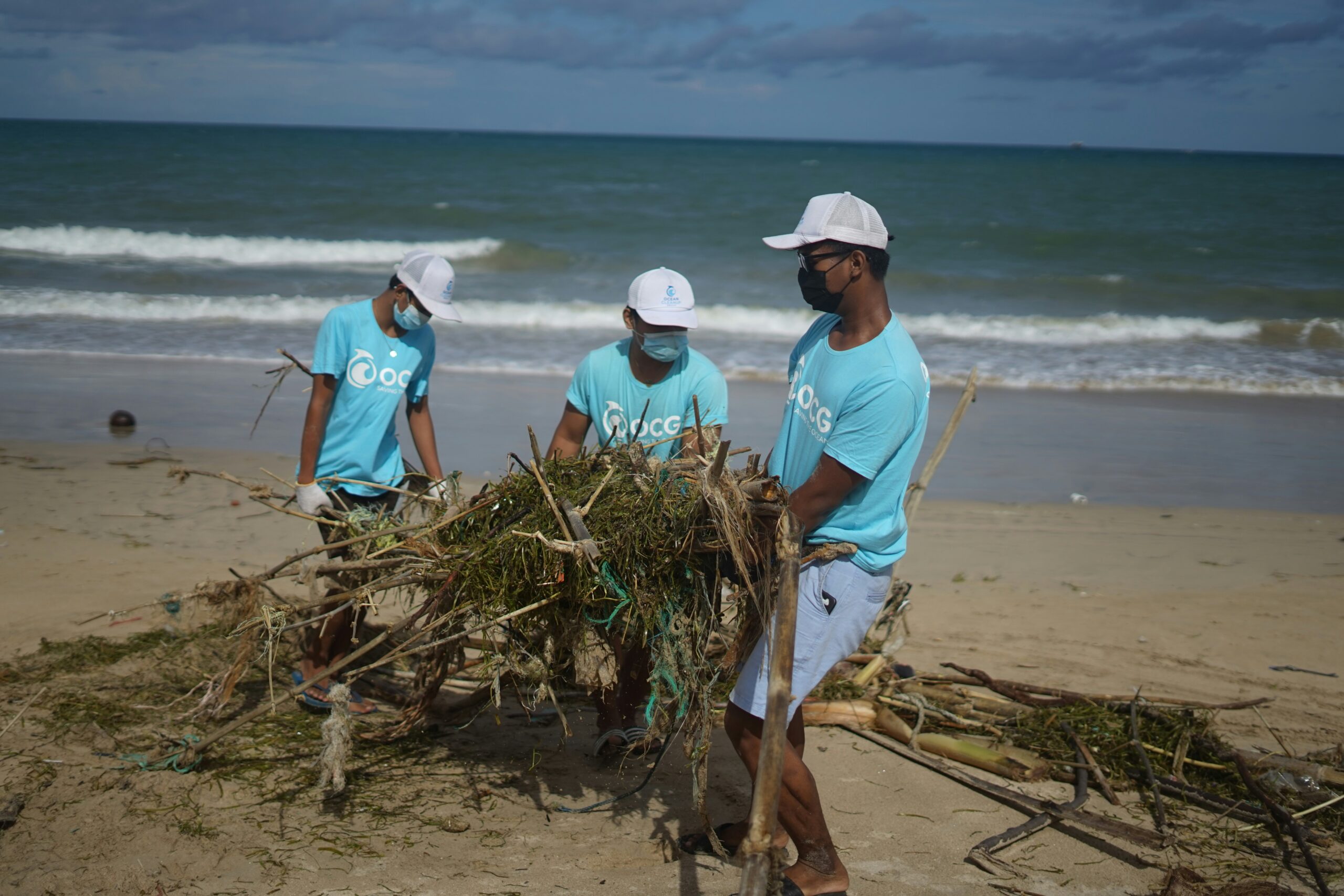 Ocean cleanup group (OCG) remove branches and fishing nets from the beach in Bali. Plastic fishing nets pose a huge problem for the environment and marine life.